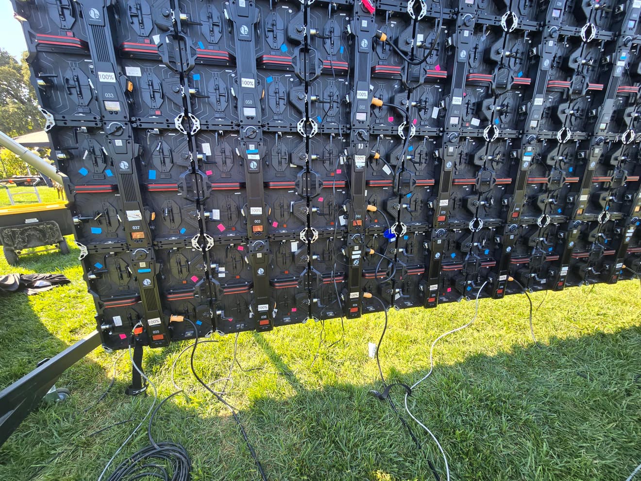 The back of an LED video wall: numbered panels, data and power run and dressed