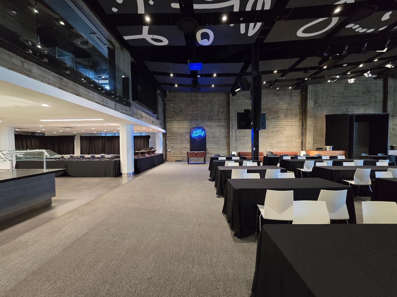 Downstairs lounge and dining setup for the SpaceX hackathon